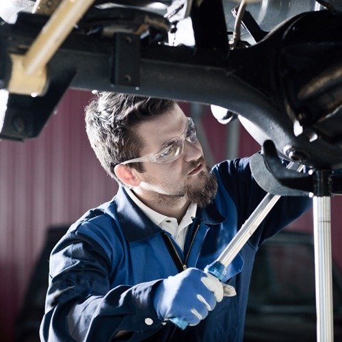 Mobile mechanic in Huntington Beach, working on a car in the field.